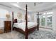 A spacious bedroom features a four-poster bed and access to the backyard at 2293 Beckenham Dr, Mount Pleasant, SC 29466