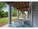 Relaxing covered outdoor space featuring swing seating and a stylish rug, offering a serene retreat at 2293 Beckenham Dr, Mount Pleasant, SC 29466