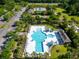 Aerial view of community pool with lounging chairs and umbrellas near a well-manicured lawn at 2293 Beckenham Dr, Mount Pleasant, SC 29466