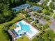 Aerial view of community pool with plenty of seating, umbrellas and clubhouse at 2293 Beckenham Dr, Mount Pleasant, SC 29466