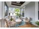 Screened-in porch with comfortable seating and blue accents at 2293 Beckenham Dr, Mount Pleasant, SC 29466