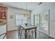 Cozy breakfast nook with a dark wood table, modern chairs, and sliding glass doors to an enclosed patio at 240 Mayfield Dr, Goose Creek, SC 29445