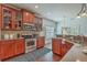 Modern kitchen with granite countertops, stainless steel appliances, wood cabinets, and hardwood flooring at 240 Mayfield Dr, Goose Creek, SC 29445