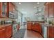 Modern kitchen with granite countertops, stainless steel appliances, wood cabinets, and hardwood flooring at 240 Mayfield Dr, Goose Creek, SC 29445