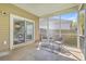 Screened porch with patio furniture and sliding glass doors leading to the interior space at 240 Mayfield Dr, Goose Creek, SC 29445