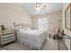 Bedroom with full bed, ceiling fan, vaulted ceiling and side table at 241 Kelsey Blvd, Wando, SC 29492