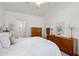 Bright bedroom featuring a comfortable bed and classic wooden furniture at 241 Kelsey Blvd, Wando, SC 29492