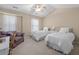 Guest bedroom with twin beds, ceiling fan, couch, and vaulted ceiling at 241 Kelsey Blvd, Wando, SC 29492