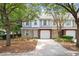 Charming townhome featuring attached garages and brick accents at 241 Kelsey Blvd, Wando, SC 29492