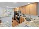 Kitchen featuring stainless steel appliances, granite countertops, and light wood cabinetry at 241 Kelsey Blvd, Wando, SC 29492