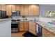 Kitchen featuring stainless steel appliances, light wood cabinets and granite countertops at 241 Kelsey Blvd, Wando, SC 29492