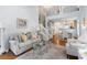 Comfortable living room showcases hardwood floors, stylish furniture, and a staircase at 241 Kelsey Blvd, Wando, SC 29492