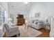 Bright living room with vaulted ceilings, a comfortable sofa, and hardwood floors at 241 Kelsey Blvd, Wando, SC 29492