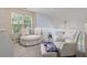 Reading loft area with a window and 2 plush sitting chairs at 241 Kelsey Blvd, Wando, SC 29492