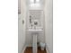 Clean powder room with a pedestal sink and neutral decor at 241 Kelsey Blvd, Wando, SC 29492