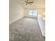Bedroom with neutral carpet, a ceiling fan and a large window at 2494 Etiwan Ave # 9-D, Charleston, SC 29414