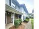 Exterior view of a two-story home with brick accents and manicured landscaping at 2494 Etiwan Ave # 9-D, Charleston, SC 29414