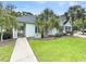 Charming one-story home with mature palm trees and lush green lawn at 2494 Etiwan Ave # 9-D, Charleston, SC 29414
