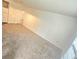 Bright living room with neutral carpet and fresh white walls at 2494 Etiwan Ave # 9-D, Charleston, SC 29414