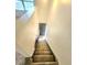 Carpeted stairway to front door with overhead skylight at 2494 Etiwan Ave # 9-D, Charleston, SC 29414