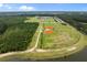 Aerial view of multiple baseball fields and facilities near a pond, perfect for sports enthusiasts at 255 Saxony Loop, Summerville, SC 29486