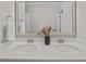 Bright bathroom features a double sink, quartz countertops, and a large framed mirror at 255 Saxony Loop, Summerville, SC 29486