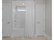 A simple bathroom features a tub/shower combo, white tile surround and tile floor at 255 Saxony Loop, Summerville, SC 29486