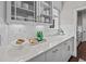 Stylish counter with glass-front cabinets, displaying dishes and glassware, plus ample countertop space at 255 Saxony Loop, Summerville, SC 29486