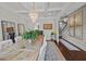 Dining room with a long table, elegant chandelier, and decorative mirrors, perfect for entertaining at 255 Saxony Loop, Summerville, SC 29486