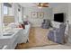 Cozy living room with plush seating, area rug, and a large television at 255 Saxony Loop, Summerville, SC 29486