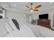 A calming primary bedroom offers a large bed, TV and sitting area at 255 Saxony Loop, Summerville, SC 29486