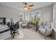 This well-lit office features multiple windows and a ceiling fan at 255 Saxony Loop, Summerville, SC 29486