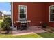 Home boasts a brick patio, a grill, and outdoor seating, perfect for entertaining guests at 255 Saxony Loop, Summerville, SC 29486