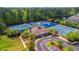 Aerial view of community tennis courts and clubhouse surrounded by lush greenery at 2582 Kingsfield St, Mount Pleasant, SC 29466