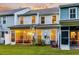 Home's backyard featuring a screened in porch and well-manicured lawn at 2582 Kingsfield St, Mount Pleasant, SC 29466