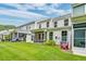 A backyard with a beautiful lawn, porch, and patio perfect for entertaining guests or relaxing with the Gathering at 2582 Kingsfield St, Mount Pleasant, SC 29466