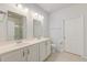 Bright bathroom features double sinks, framed mirrors, and neutral tile flooring at 2582 Kingsfield St, Mount Pleasant, SC 29466