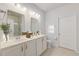 Bright bathroom featuring a double sink vanity, tile floors, and a shower at 2582 Kingsfield St, Mount Pleasant, SC 29466