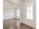 Bright, open dining space with hardwood floors and a view into the dining room, perfect for entertaining guests at 2582 Kingsfield St, Mount Pleasant, SC 29466