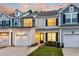 Charming townhome with neutral siding, black shutters, and manicured front lawn in a residential neighborhood at 2582 Kingsfield St, Mount Pleasant, SC 29466