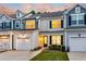 Charming two-story townhome featuring a garage, well-manicured lawn, and inviting front entrance at 2582 Kingsfield St, Mount Pleasant, SC 29466