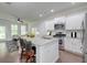 Bright kitchen with white cabinets, stainless steel appliances, granite countertops, and a breakfast bar with seating at 2582 Kingsfield St, Mount Pleasant, SC 29466