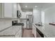 Well-equipped kitchen with white cabinets, stainless steel appliances, and granite countertops, providing ample space at 2582 Kingsfield St, Mount Pleasant, SC 29466