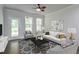 Cozy living room with stylish furniture, a ceiling fan, and access to the outdoors, creating a comfortable space at 2582 Kingsfield St, Mount Pleasant, SC 29466