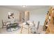 Stylishly furnished home office space with glass desk and decor at 2582 Kingsfield St, Mount Pleasant, SC 29466