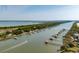 Aerial view of homes along waterway, showing private docks and boats on a clear, sunny day at 2619 Buccaneer Rd, Isle of Palms, SC 29451