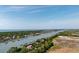 Overhead shot of the waterfront houses with personal docks lining the community near a bridge and ocean at 2619 Buccaneer Rd, Isle of Palms, SC 29451