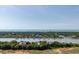 Spectacular aerial view capturing multiple waterfront properties with private docks, leading to the ocean at 2619 Buccaneer Rd, Isle of Palms, SC 29451