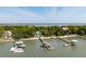 Aerial view of waterfront homes with private docks on a sunny day, showcasing beautiful shoreline and natural surroundings at 2619 Buccaneer Rd, Isle of Palms, SC 29451