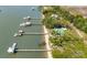 Aerial view showcases waterfront properties with private docks, sandy beach, and lush greenery at 2619 Buccaneer Rd, Isle of Palms, SC 29451
